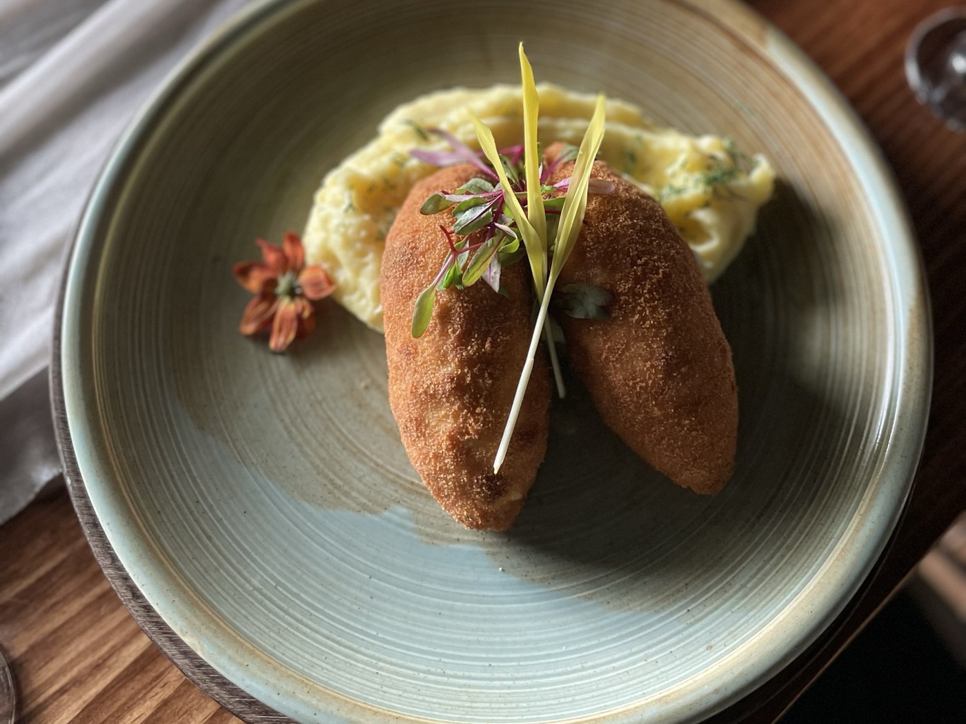Chicken Kiev with mashed potatoes, mozzarella, butter and dill