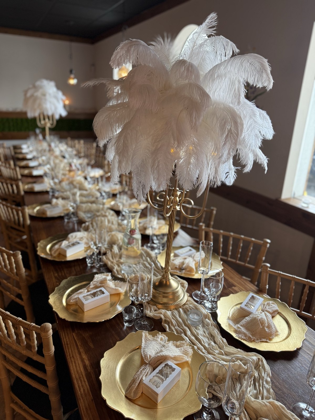 Feather centerpiece detail on a set banquet table