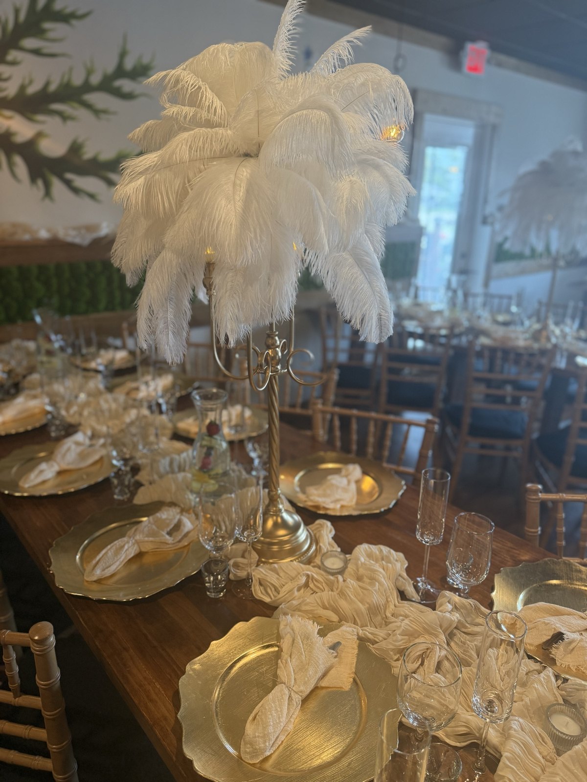 Place setting detail with gold charger and candle