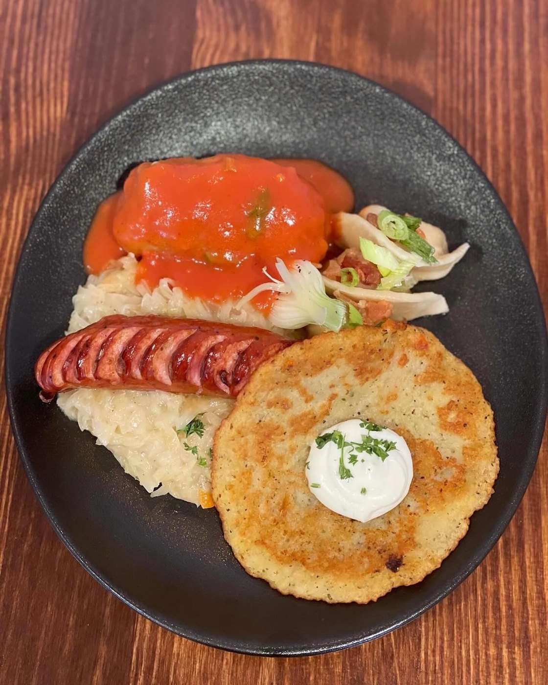Polish Plate Nad Tatrami with stuffed cabbage, sausage, pierogi and potato pancake